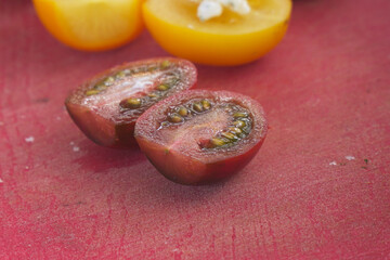 Sliced tomatoes on a cutting board