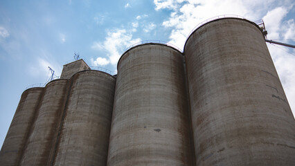 Towering Grain Silos Against a Blue Sky in Rural Washington