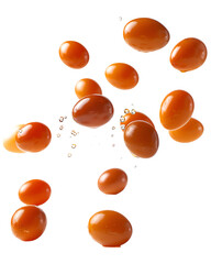 Many orange eggs falling on black background