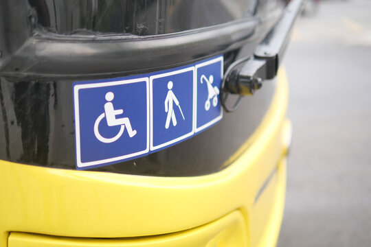 Signs indicating accessibility features on public transport