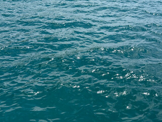 Blue sea waves shiny surface