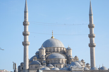 Fototapeta premium Beautiful mosque with minarets under clear blue sky
