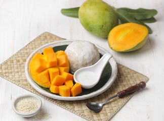 Mango sticky rice is a Thai dessert made from sticky rice, mango and coconut milk.