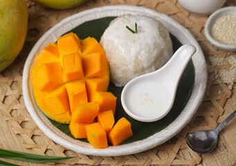 Mango sticky rice is a Thai dessert made from sticky rice, mango and coconut milk.