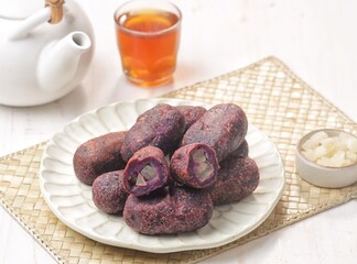Timus Ubi Ungu. Purple sweet potato thymus filled with candied bligo. Many are used as typical Karanganyar souvenirs