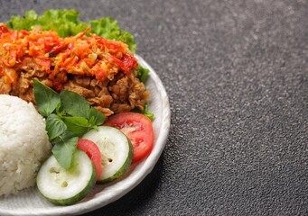 Ayam geprek is a typical Indonesian fried chicken dish with flour that is mashed or mashed with...