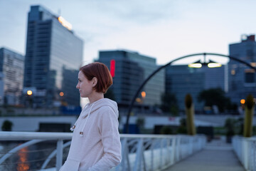 Sporty woman runner preparing for morning running workout.