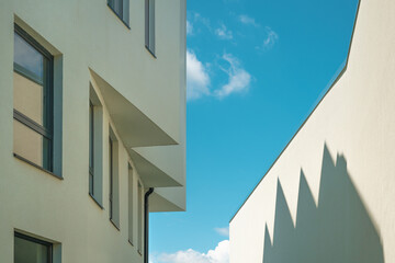 Architectural pattern, modern residential building facade with shadow and light, minimalistic...