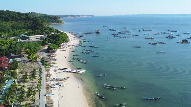 Aerial View of Coastal Village with Fishing Boats and Beach Ekas Lombok, Indonesia