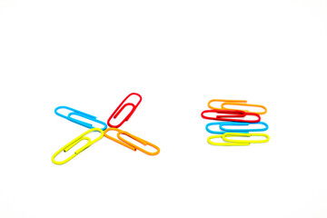 Colorful paper clips on a white background, arranged in a creative, organized and isolated view