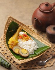 Nasi Liwet Solo. Typical Solo savory rice with side dishes of shredded chicken, chayote, boiled...
