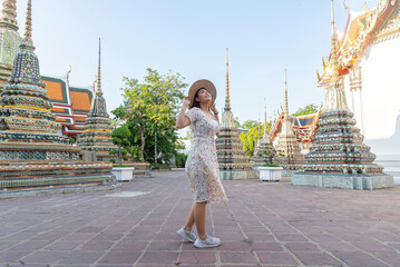 Traveler tourist enjoy walking to see the historic park of Thailand exciting to explore the...