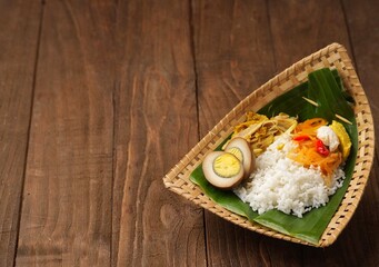 Nasi Liwet Solo. Typical Solo savory rice with side dishes of shredded chicken, chayote, boiled eggs, areh and steamed egg whites.