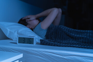 Annoyed, stressed, anxiety asian young woman suffering from insomnia, frustrated awake on bed at...