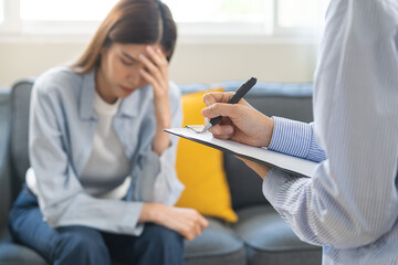 Psychology, depression. Suffer asian young woman consultation with psychologist while patient...