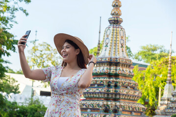 Traveler tourist enjoy walking to see the historic park of Thailand exciting to explore the...