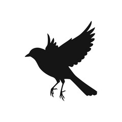 Obraz premium Silhouette of a small bird in flight, wings outstretched, legs extended.