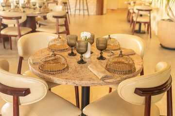 Fancy Indian Restaurant Table Setup with Napkins, plates, glasses and candle