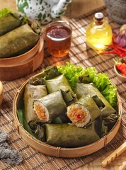 Arem-arem (arěm-arěm) is a snack in the form of rice filled with vegetables or fried chili sauce