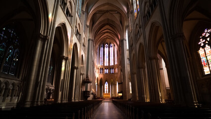 Obraz premium Large church with many pews and stained glass windows