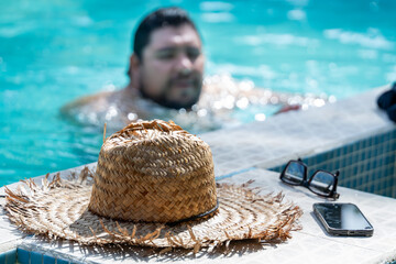 Costa Rican tourist relaxing by the pool at Tortuguero, Costa Rica