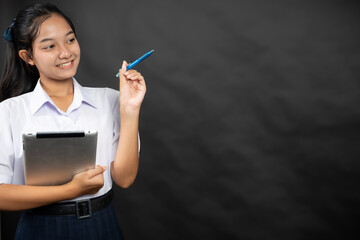 An Asian high school girl attends international webinars on education to gain knowledge that will...