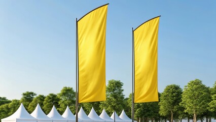 Two blank yellow feather flags stand tall against a clear blue sky with a line of white tents and green trees in the background