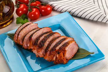 Sliced duck breast baked with cherry