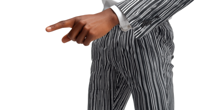 Elegant businessman gesturing with a finger to indicate direction, isolated on white background.