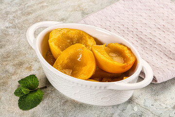 Canned marinated peach in syrop