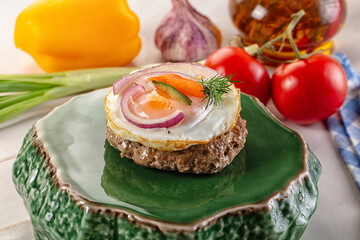 Beefsteak chop with roasted egg