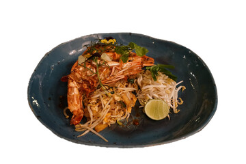 Isolated dish of Pad Thai, Thailand signature fried noodles with shrimp and tamarind sauce