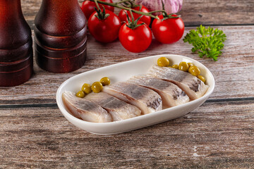 Slided marinated salted herring fillet