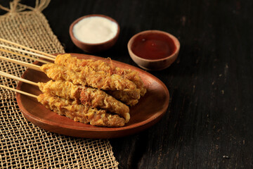 Telor Gulung, Street Food from Indonesia, Egg Rolled on Skewers, Cheap Snack