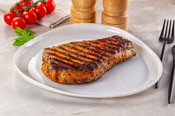 Grilled pork steak with bone