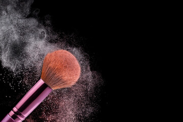 Pink color makeup tools for women's fashion and beauty on face isolated on black background