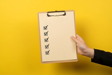 suitable for enhancing time management practices. hand holding a beige clipboard with a checklist on a bright yellow background, immaculate representation of a paper checklist on a bright background