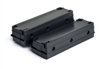 Two black plastic electronics boxes on white background