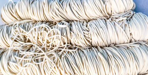 close up of a pile of steel chopsticks