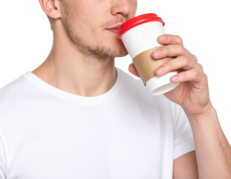A man in a white t-shirt drinks from a takeaway coffee cup with a red lid against a black background.