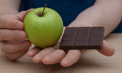 Healthy eating, good choices, apple or dark chocolate