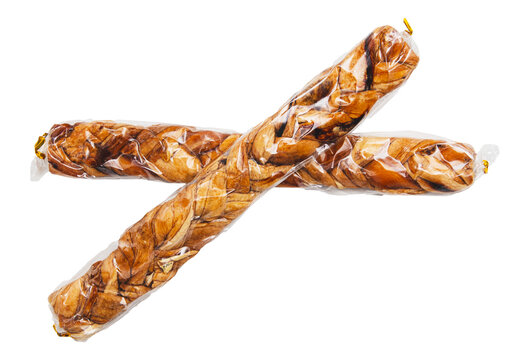 Two pieces of food wrapped in plastic - Powered by Adobe