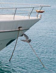 A boat is tied to the dock with a rope