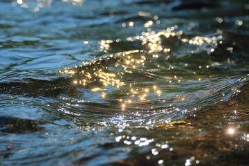 summer sunlight over water with abstract wave flare and flickers motion