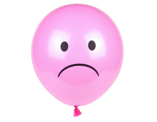 Fototapeta premium A pink balloon with a sad face drawn on it, featuring two black oval eyes and a downward curved mouth.