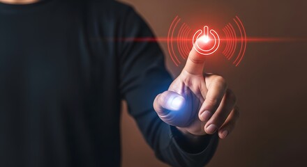 Person in dark suit pressing holographic red power button with glowing blue light and radiating lines symbolizing activation