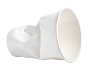 A crumpled white paper cup lying on its side, showing creases and indentations from being crushed.
