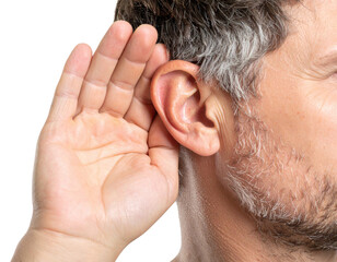 A close-up of a man cupping his hand behind his ear, signaling the act of listening intently.