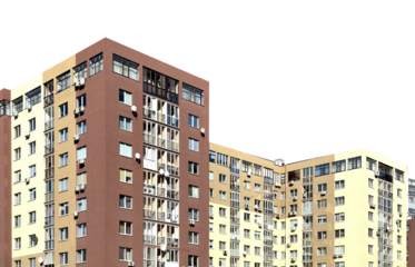 Modern multi story apartment building with a beige facade. Residential accommodation featuring