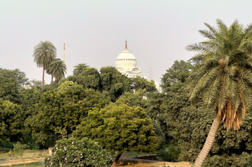 Safdarjung Tomb in Delhi, India. Historic Mughal monument with a grand dome, surrounded by lush